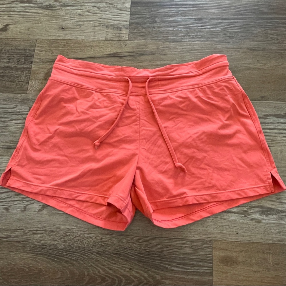 Athleta orange workout shorts M